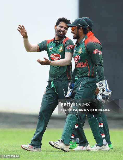 Bangladesh cricketer Mashrafe Mortaza celebrates with teammates after dismissing Sri Lanka Board President's XI cricketer Wanindu Hasaranga during...