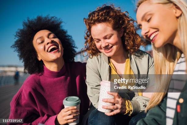 girls drinking coffee - reusable cup stock pictures, royalty-free photos & images