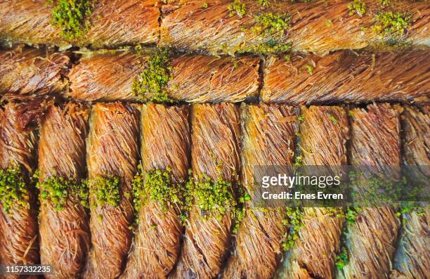 baklava cake - pistachio roll dessert - pistachio mediterranean dessert - turkish delight stock pictures, royalty-free photos & images