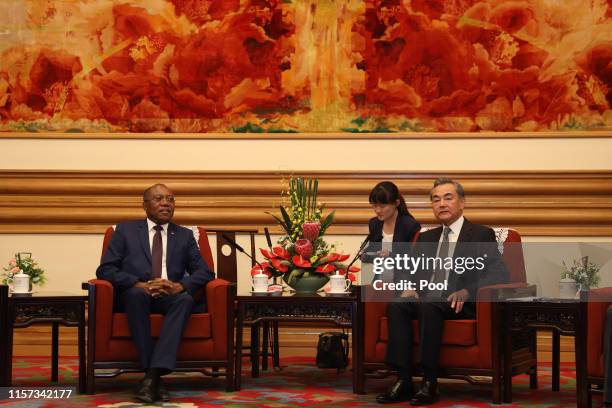 Chinese Foreign Minister Wang Yi welcomes Angola's Foreign Minister Manuel Augusto at the Zhongnanhai leadership compound on July 23, 2019 in...