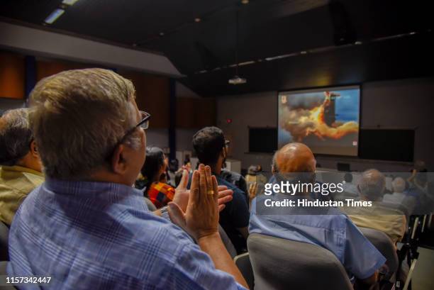 Research scholars and scientists watch the live telecast of launch of 'Chandrayaan-2' at IUCAA in SPPU, on July 22, 2019 in Pune, India. The...