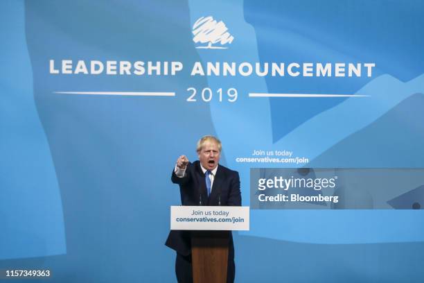 Boris Johnson, leader of the Conservative Party, gestures as he makes a speech as he is announced the winner of the Conservative Party leadership...