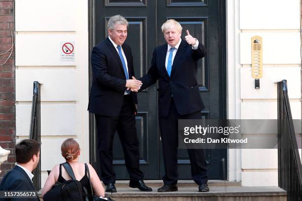 Newly elected Conservative party leader Boris Johnson poses with Conservative party Chairman, Brandon Lewis outside the Conservative Leadership...