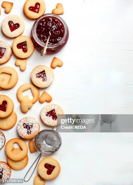 Traditional Linzer cookie with strawberry jam. Top view. Copy space. Valentine's day concept.