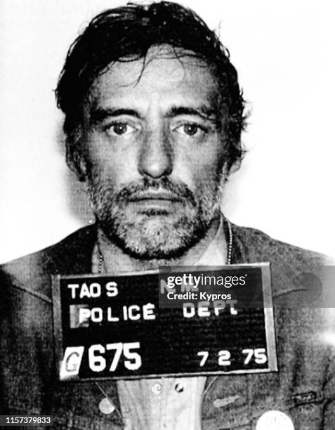 In this handout, American actor, filmmaker, photographer, and artist Dennis Hopper in a mug shot following his arrest, New Mexico, July 1975.