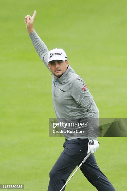 Keegan Bradley of the United States celebrates making an eagle on the 15th hole during the second round of the Travelers Championship at TPC River...