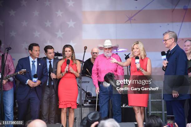 Brian Kilmeade, Adam Klotz, Jillian Mele, Charlie Daniels, Ainsley Earhardt and Steve Doocy seen onstage during FOX News Channel's "FOX & Friends"...