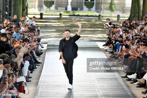 Fashion designer Kris Van Assche walks the runway at the Berluti fashion show during Paris Men's Fashion Week Spring/Summer 2020 on June 21, 2019 in...