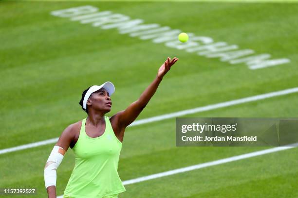 Venus Williams of the USA serves during her quarter-final match against Ashleigh Barty of Australia during day five of the Nature Valley Classic at...