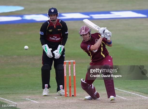 Johan Botha of Northants hits a four during the Friends Life T20 match between Northamptonshire and Durham at Wantage Road on June 9, 2011 in...