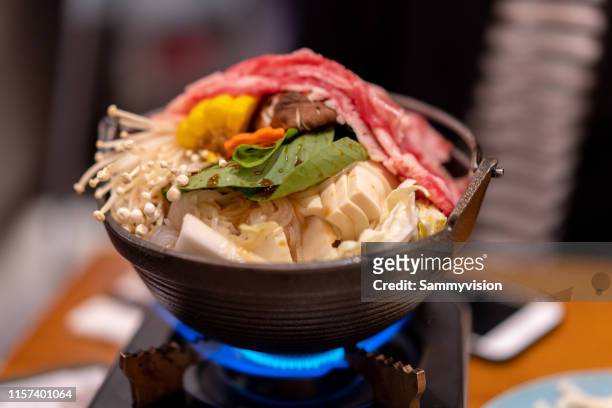 sukiyaki on the table - enoki mushroom stock pictures, royalty-free photos & images