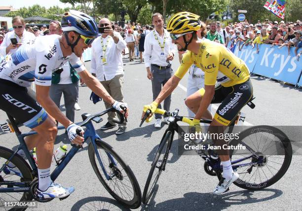 Matteo Trentin of Italy and Mitchelton-Scott bumps with a smile into yellow jersey Julian Alaphilippe of France and Deceuninck-Quick Step at the...