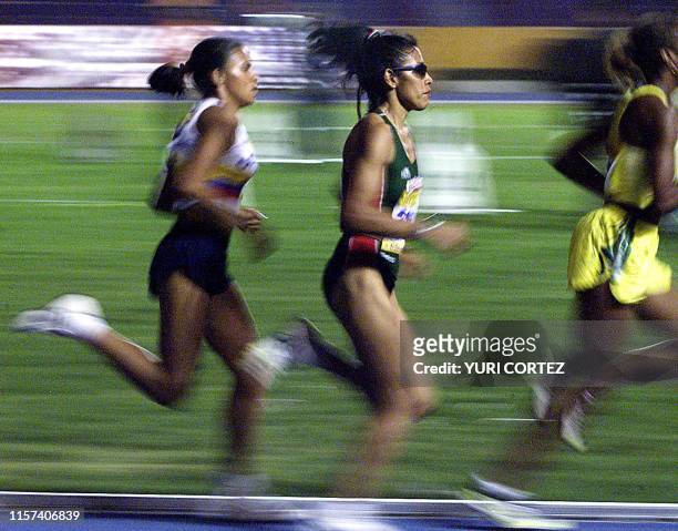 Athletes Dulce Rodriguez , Korene Hinds , and Bertha Sanches are seen competing in San Salvador, El Salvador 06 December 2002. La mexicana Dulce...