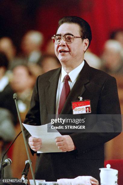 Chinese Prime Minister Li Peng adresses the opening of the party congress on October 12, 1992 in Beijing.