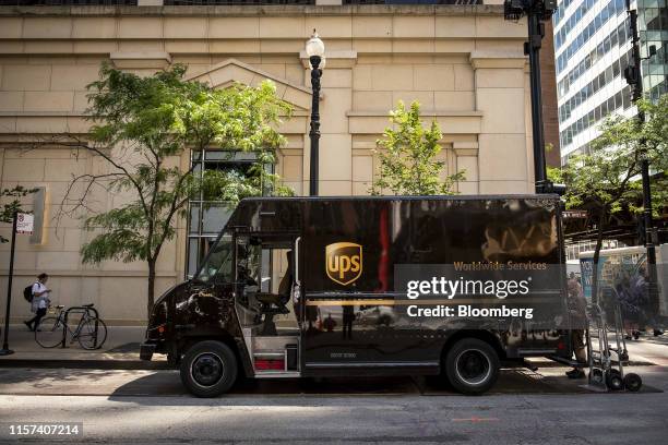 United Parcel Service Inc. Delivery driver unloads packages from a delivery truck in Chicago, Illinois, U.S., on Monday, July 22, 2019. UPS is...
