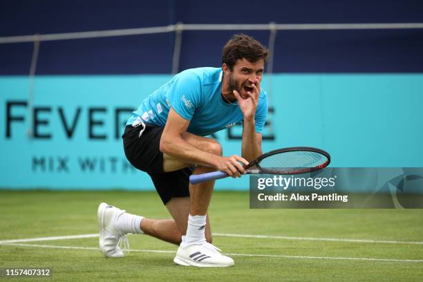 Gilles Simon of France reacts to a line call on match point during his Quarter-Final Singles Match against Nicolas Mahut of France during day Five of...