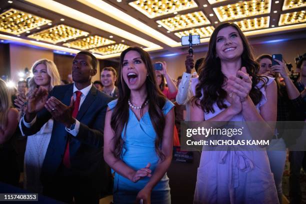 Supporters of US President Donald Trump cheer as he appears on stage before addressing the Turning Point USAs Teen Student Action Summit in...