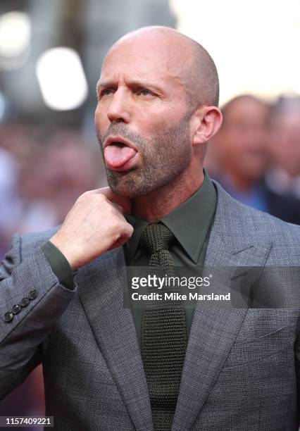 Jason Statham reacts to the hot temperatures as he attends the "Fast & Furious: Hobbs & Shaw" Special Screening at The Curzon Mayfair on July 23,...
