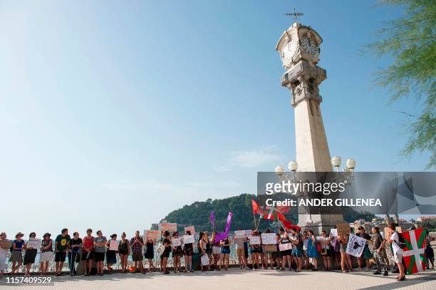 People take part in a protest against the shooting of Woody Allen's new film in the Spanish Basque city of San Sebastian on July 23, 2019. - The...