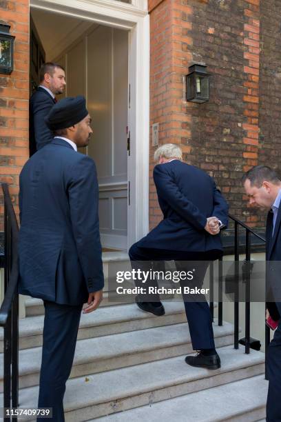 On the day that the Conservative Party elects its leader and the country's Prime Minister, Boris Johnson, surrounded by close protection police...