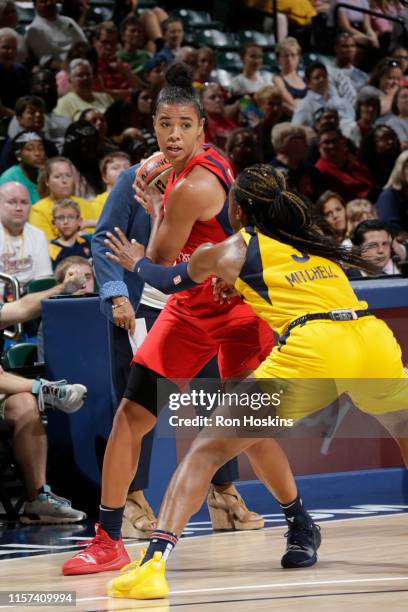 Natasha Cloud of the Washington Mystics handles the ball against the Indiana Fever on July 19, 2019 at the Bankers Life Fieldhouse in Indianapolis,...