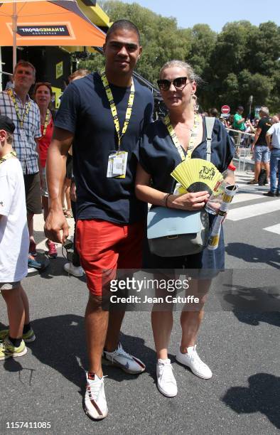 French olympic champion in handball Daniel Narcisse and his wife Emmanuelle Narcisse attend stage 16 of the 106th Tour de France 2019, a stage from...