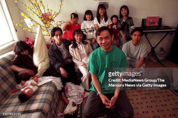 Quyen Tong , a 51-year-old Vietnamese immigrant, is photographed in the living room of his South San Jose home with his family. The Tong family who...