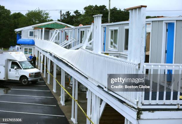 Damage to the Cape Sands Inn in Yarmouth, MA is pictured after the roof of a whole wing of the motel was blown off in what is believed to be a...