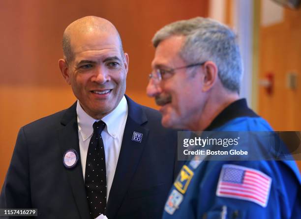 Alan Price, left, the Director of the John F. Kennedy Presidential Library and Museum in the Dorchester neighborhood of Boston, speaks with former...