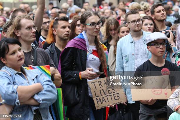 Protesters with rainbow flags and baner that speak Trans Live matter during the rally in front of Neptune fountain are seen in Gdansk, Poland on 23...