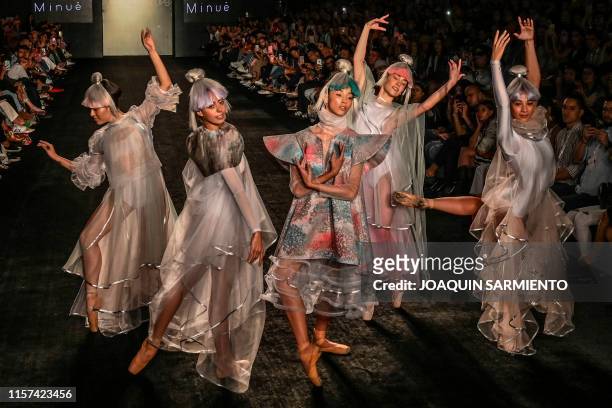 Models present creations by Fashion Design students from the Pontificia Bolivariana University during Medellin Fashion Week in Medellin, Colombia, on...