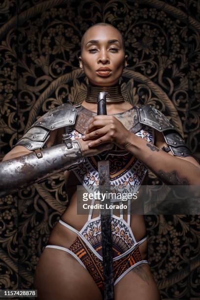 beautiful mixed race sword wielding viking warrior female - tall blonde women stock pictures, royalty-free photos & images