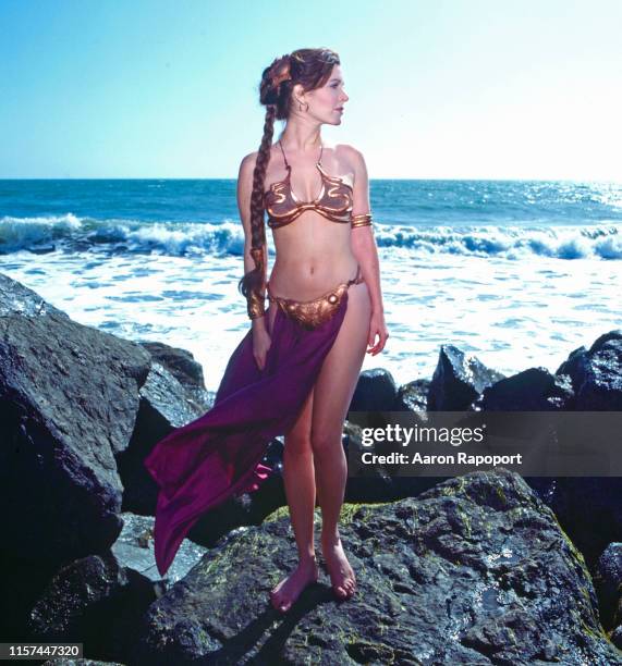 Actress Carrie Fisher poses on the beach for Star Wars in October 1983 At Stinson Beach, California.