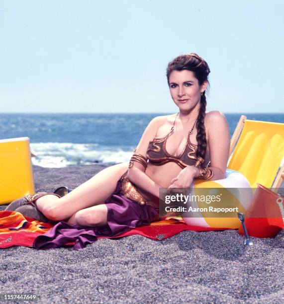 Actress Carrie Fisher poses on the beach for Star Wars in October 1983 At Stinson Beach, California.