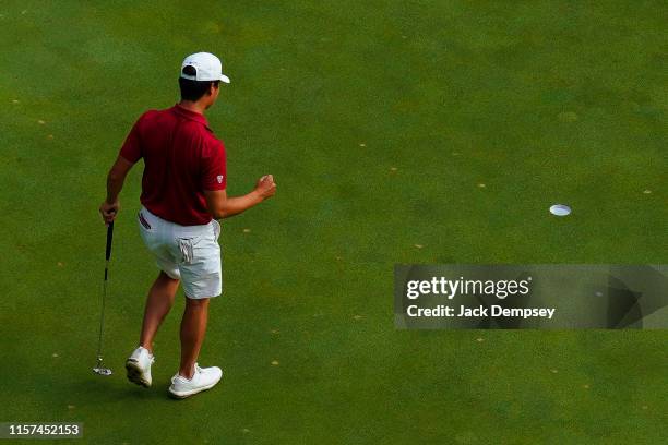 Brandon Wu of Stanford reacts to sinking a putt on the eighth hole during the Division I Men's Golf Match Play Championship held at the Blessings...