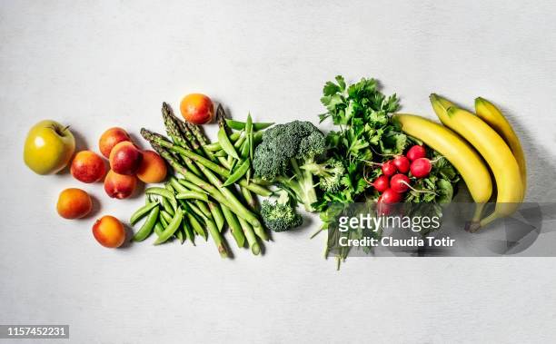 fresh vegetables and fruits on white background - obst stock-fotos und bilder