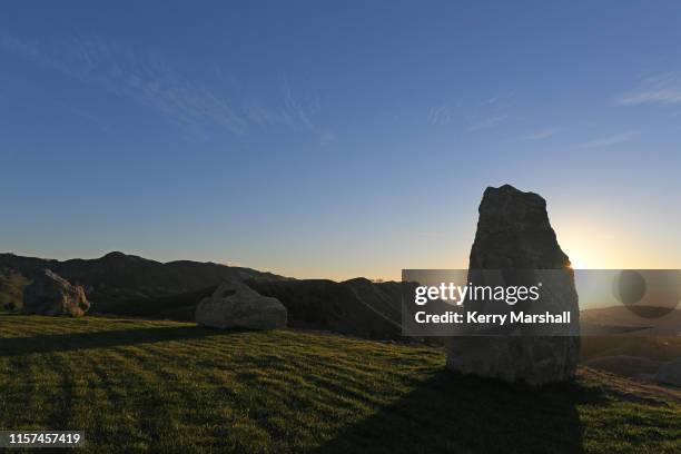 Stones stand in the first light of the sun at the Hakikino Conservation Reserve on June 22, 2019 in Waimarama, New Zealand. The Mātai Whetu - a place...