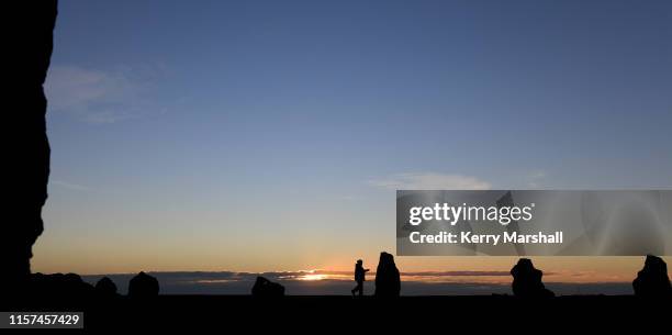 The sun rises behind clouds at the Hakikino Conservation Reserve on June 22, 2019 in Waimarama, New Zealand. The Mātai Whetu - a place to view the...