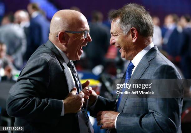 Scout Dennis Patterson of the Philadelphia Flyers and general manager Ken Holland of the Edmonton Oilers attend the first round of the 2019 NHL Draft...