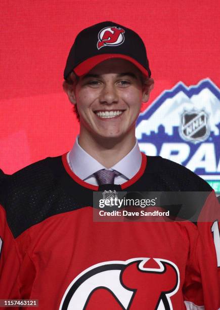 Jack Hughes, first overall pick by the New Jersey Devils, poses for a portrait onstage during the first round of the 2019 NHL Draft at Rogers Arena...