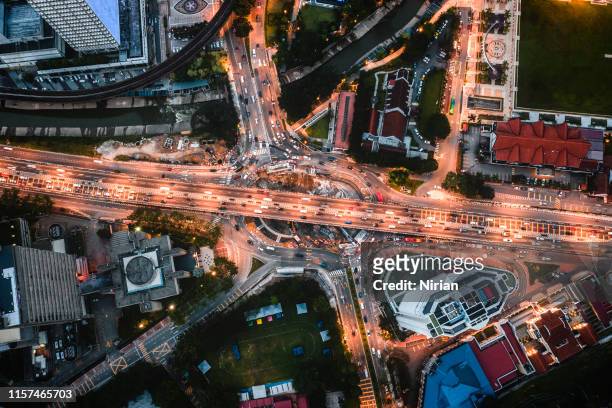 aerial view of highway and overpass in the city at night - kuala lumpur stock pictures, royalty-free photos & images