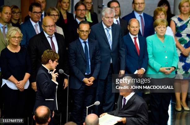 Germany's incoming Defence Minister Annegret Kramp-Karrenbauer takes her oath in front of Wolfgang Schaeuble , President of the Bundestag , during...
