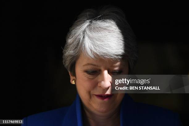 Britain's outgoing prime minister Theresa May leaves 10 Downing street to take part in her final Prime Minister Question session in the House of...