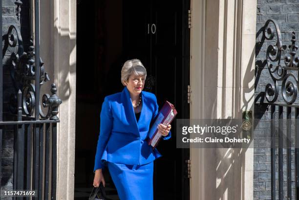 Prime Minister Theresa May leaves Downing Street to attend her final Prime Ministers Question Time at the House of Commons on 24th July, 2019 in...
