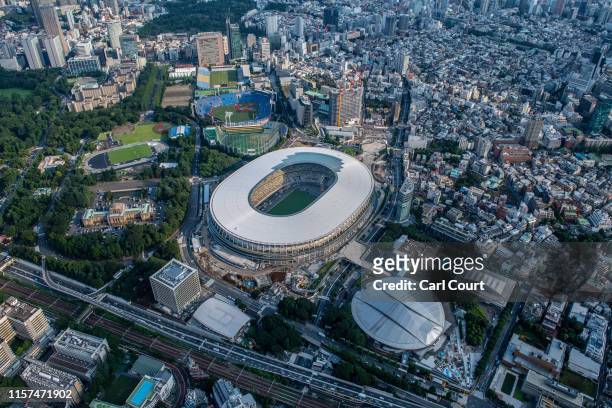 The New National Stadium, the main stadium for the Tokyo 2020 Olympics, and the Tokyo Metropolitan Gymnasium are pictured on July 24, 2019 in Tokyo,...