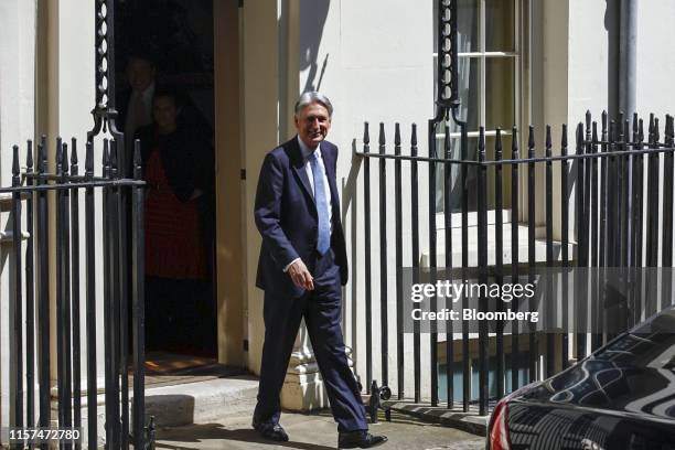 Philip Hammond, U.K. Chancellor of the exchequer, departs number 11 Downing Street to attend a weekly questions and answers session in Parliament in...