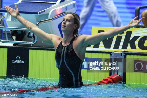 Italy's Federica Pellegrini celebrates taking gold in the final of the women's 200m freestyle event during the swimming competition at the 2019 World...