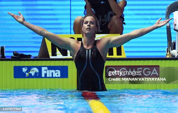 Italy's Federica Pellegrini celebrates taking gold in the final of the women's 200m freestyle event during the swimming competition at the 2019 World...