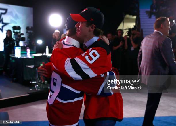 Cole Caufield , fifteenth overall pick of the Montreal Canadiens, and Jack Hughes, first overall pick of the New Jersey Devils, congratulate one...