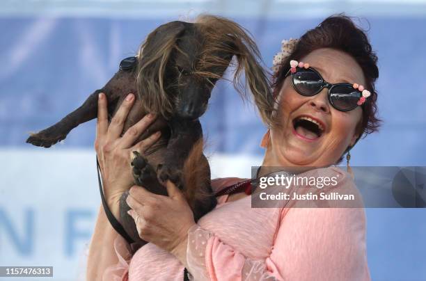 Heather Wilson holds her dog Himisaboo during the World's Ugliest Dog contest at the Marin-Sonoma County Fair on June 21, 2019 in Petaluma,...